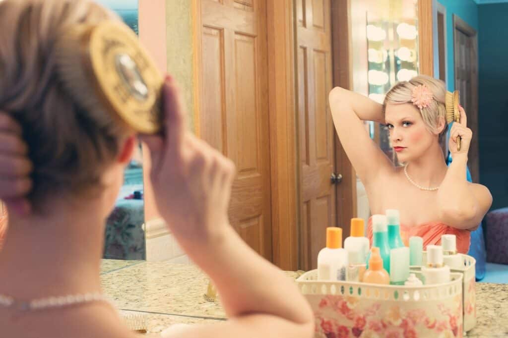 blonde woman brushing hair