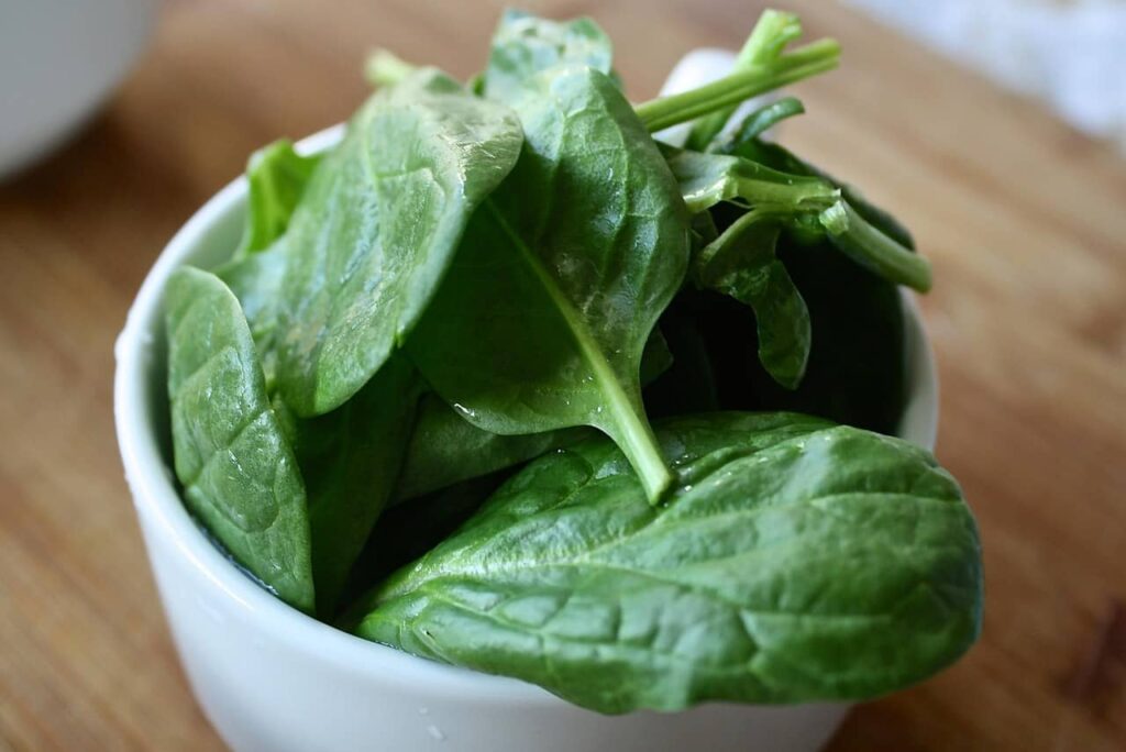 Fresh spinach leaves — vitamin-packed greens for glowing, youthful skin