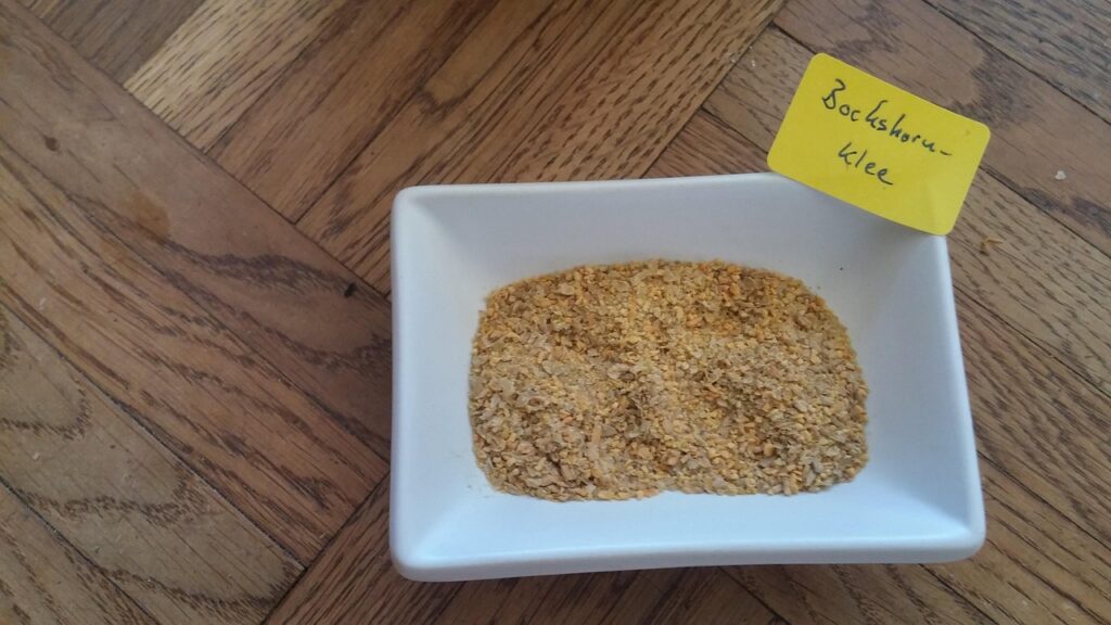 fenugreek seeds in a white dish