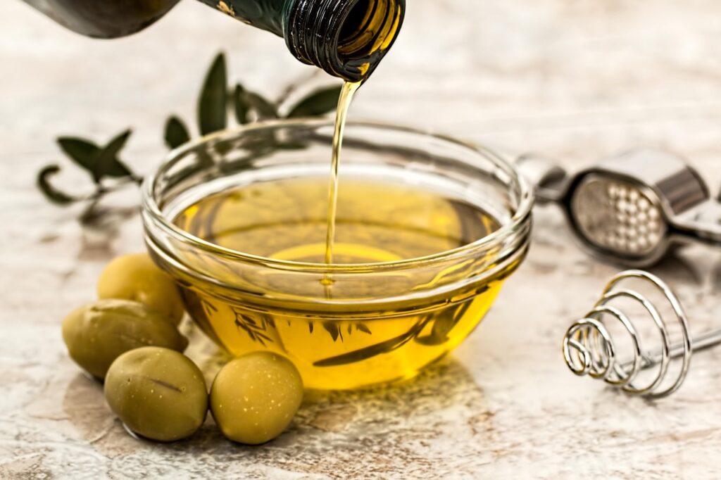 pouring olive oil into a small dish