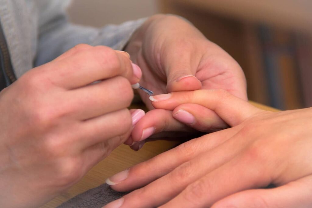 woman getting a Nail Care Routine for Faster Growth
