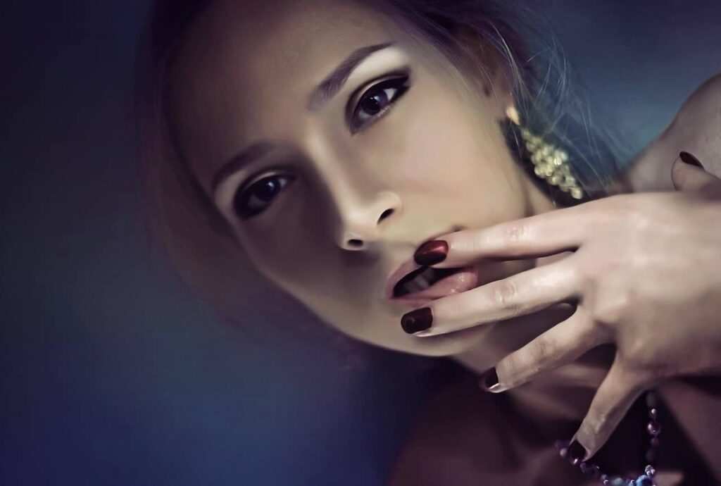 woman touching her lips